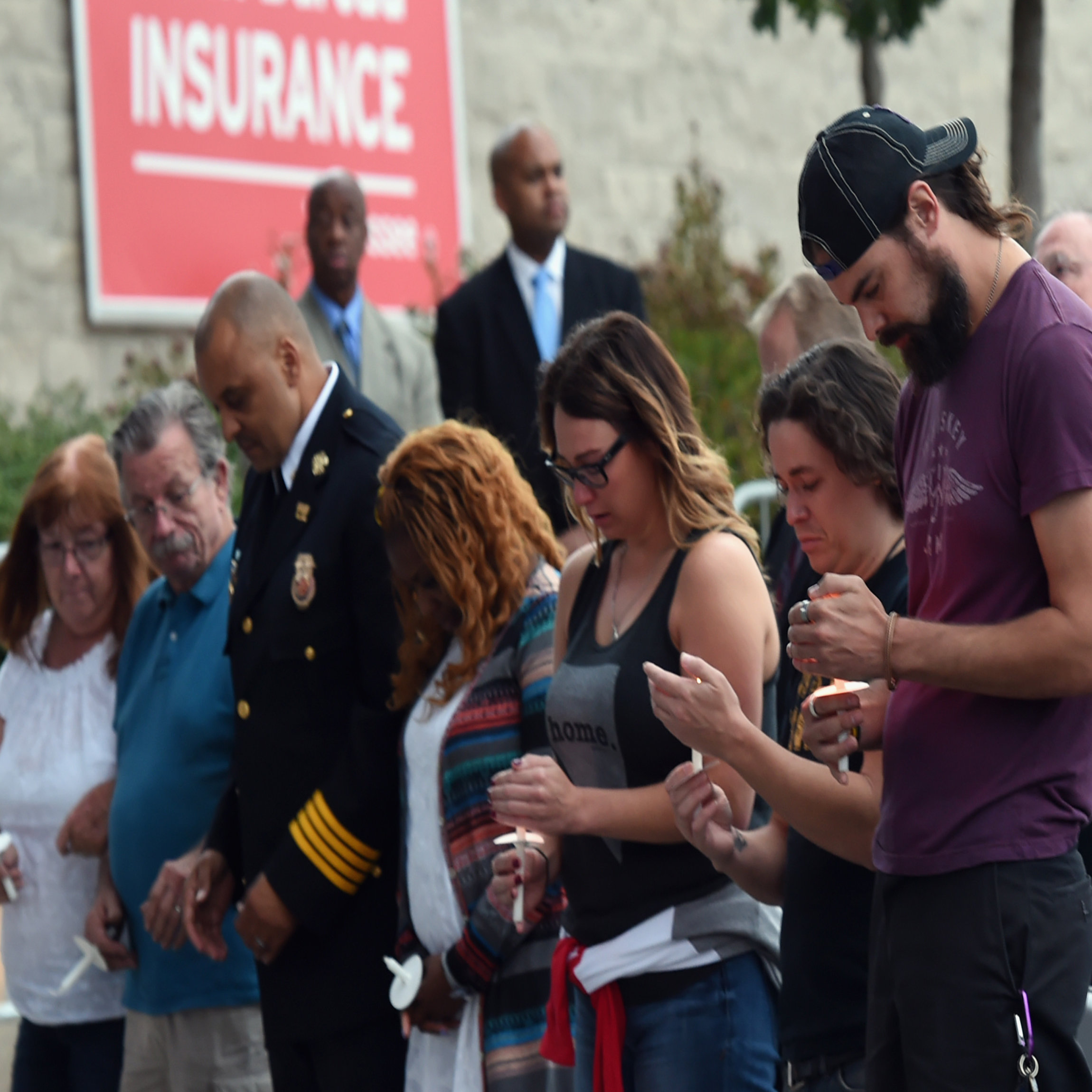 NASHVILLE, TN - OCTOBER 02: People gather during a candlelight vigil for victims of the Las Vegas shooting at Ascend Amphitheater on October 2, 2017 in Nashville, Tennessee. Late Sunday night, a lone gunman, Stephan Paddock, 64, of Mesquite, Nevada, opened fire on attendees at the Route 91 Harvest Festival, a three-day country music festival, leaving at least 59 dead and over 500 injured before killing himself. The massacre is one of the deadliest mass shooting events in U.S. history. (Photo by Rick Diamond/Getty Images)