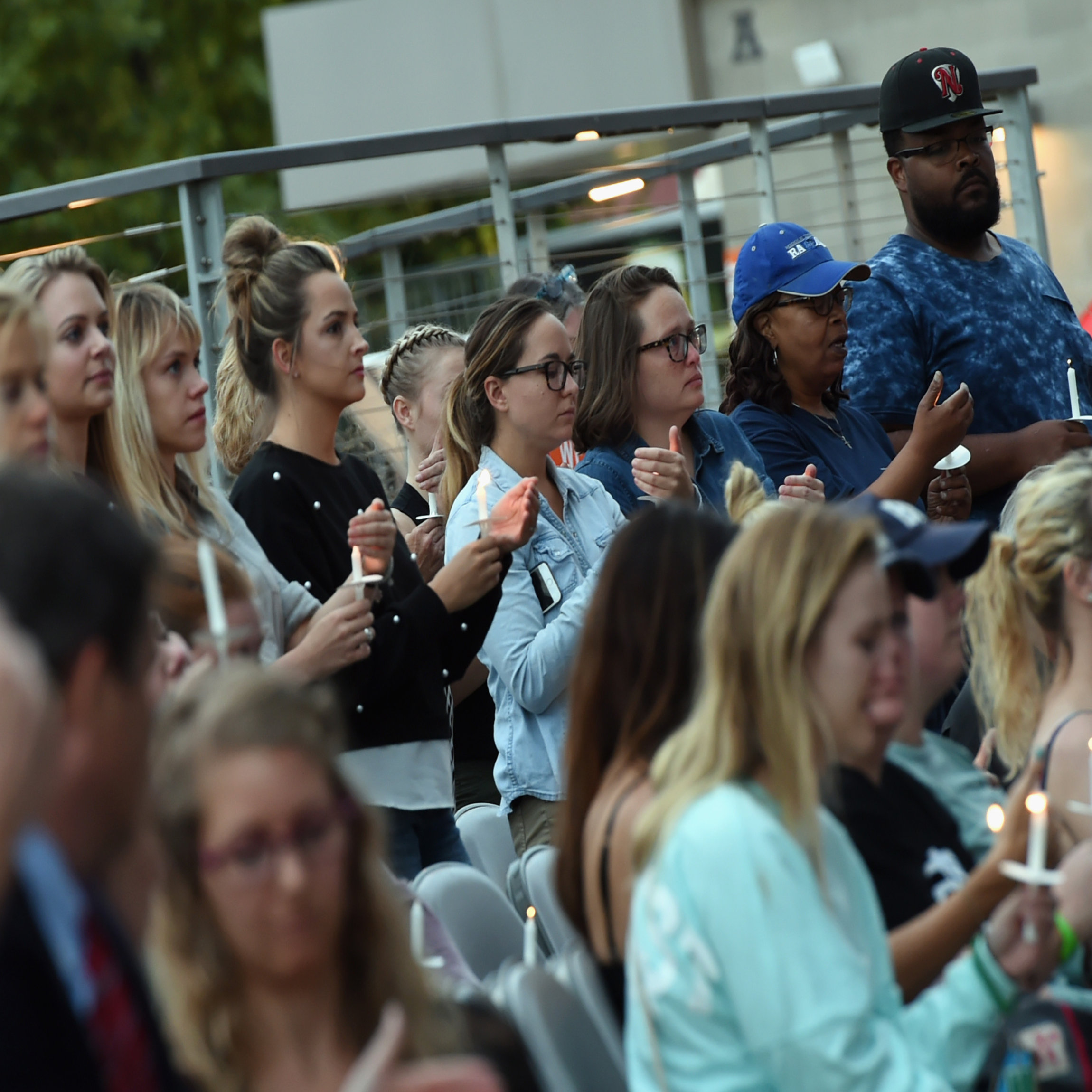 NASHVILLE, TN - OCTOBER 02: People gather during a candlelight vigil for victims of the Las Vegas shooting at Ascend Amphitheater on October 2, 2017 in Nashville, Tennessee. Late Sunday night, a lone gunman, Stephan Paddock, 64, of Mesquite, Nevada, opened fire on attendees at the Route 91 Harvest Festival, a three-day country music festival, leaving at least 59 dead and over 500 injured before killing himself. The massacre is one of the deadliest mass shooting events in U.S. history. (Photo by Rick Diamond/Getty Images)