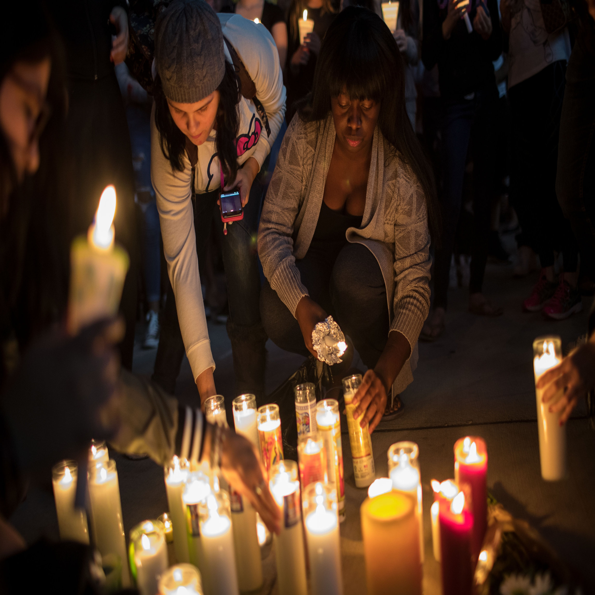 LAS VEGAS, NV - OCTOBER 2: Mourners light candles during a vigil at the corner of Sahara Avenue and Las Vegas Boulevard for the victims of Sunday night's mass shooting, October 2, 2017 in Las Vegas, Nevada. Late Sunday night, a lone gunman killed more than 50 people and injured more than 500 people after he opened fire on a large crowd at the Route 91 Harvest Festival, a three-day country music festival. The massacre is one of the deadliest mass shooting events in U.S. history. (Photo by Drew Angerer/Getty Images)