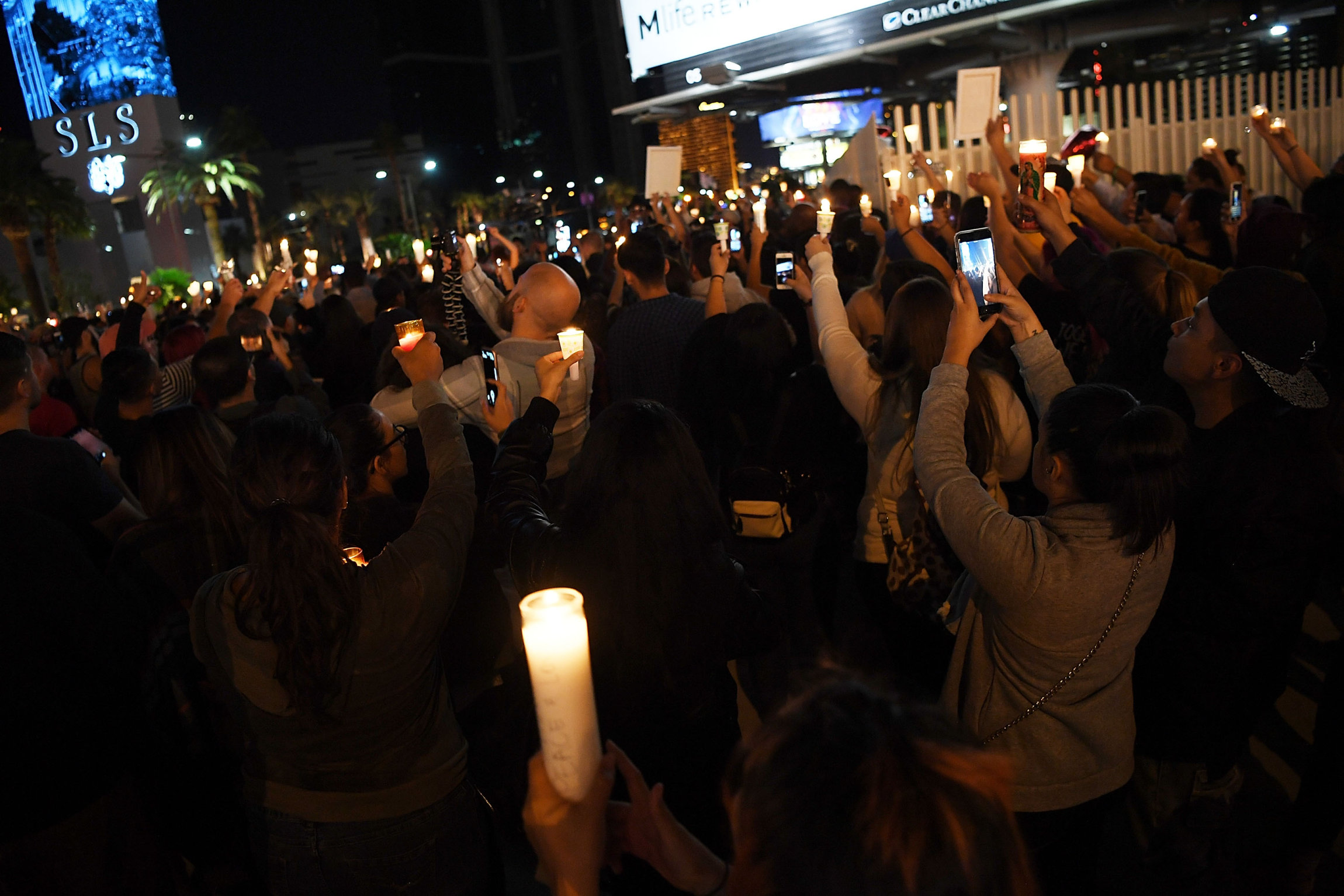 LAS VEGAS, NV - OCTOBER 02: Hundreds of people gather for a vigil on the Las Vegas strip, for the victims of the Route 91 Harvest country music festival shootings on October 2, 2017 in Las Vegas, Nevada. Lone gunman Stephan Paddock, 64, of Mesquite, Nevada opened fire on festival attendees leaving at least 59 dead and over 500 injured before killing himself. The investigation is ongoing. (Photo by Denise Truscello/Getty Images)