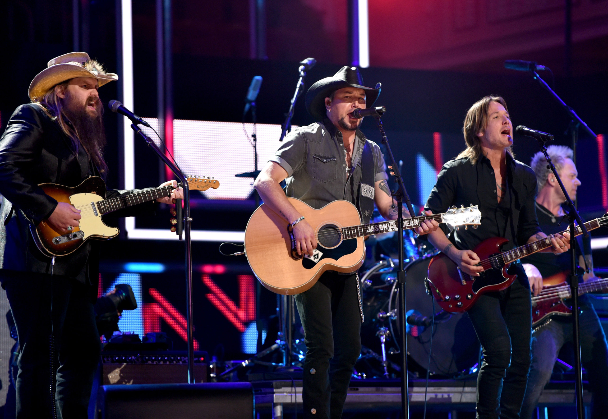 NASHVILLE, TN - OCTOBER 18: (L-R) Honorees Chris Stapleton, Jason Aldean and Keith Urban perform onstage at the 2017 CMT Artists Of The Year on October 18, 2017 in Nashville, Tennessee. (Photo by Rick Diamond/Getty Images for CMT)