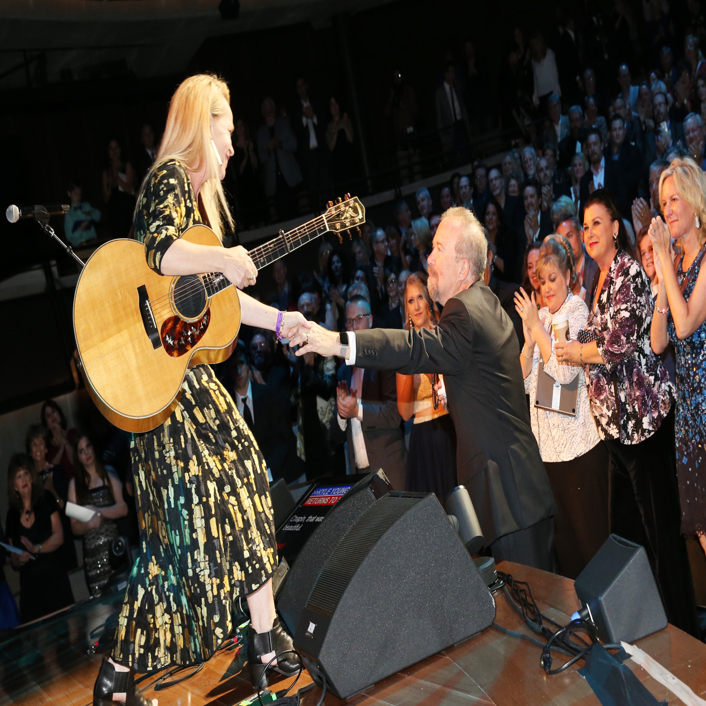 NASHVILLE, TN - OCTOBER 22: Mary Chapin Carpenter shares a moment with songwriter Don Schlitz onstage at the Country Music Hall of Fame and Museum Medallion Ceremony to celebrate 2017 hall of fame inductees Alan Jackson, Jerry Reed And Don Schlitz at Country Music Hall of Fame and Museum on October 22, 2017 in Nashville, Tennessee. (Photo by Terry Wyatt/Getty Images for Country Music Hall Of Fame & Museum)