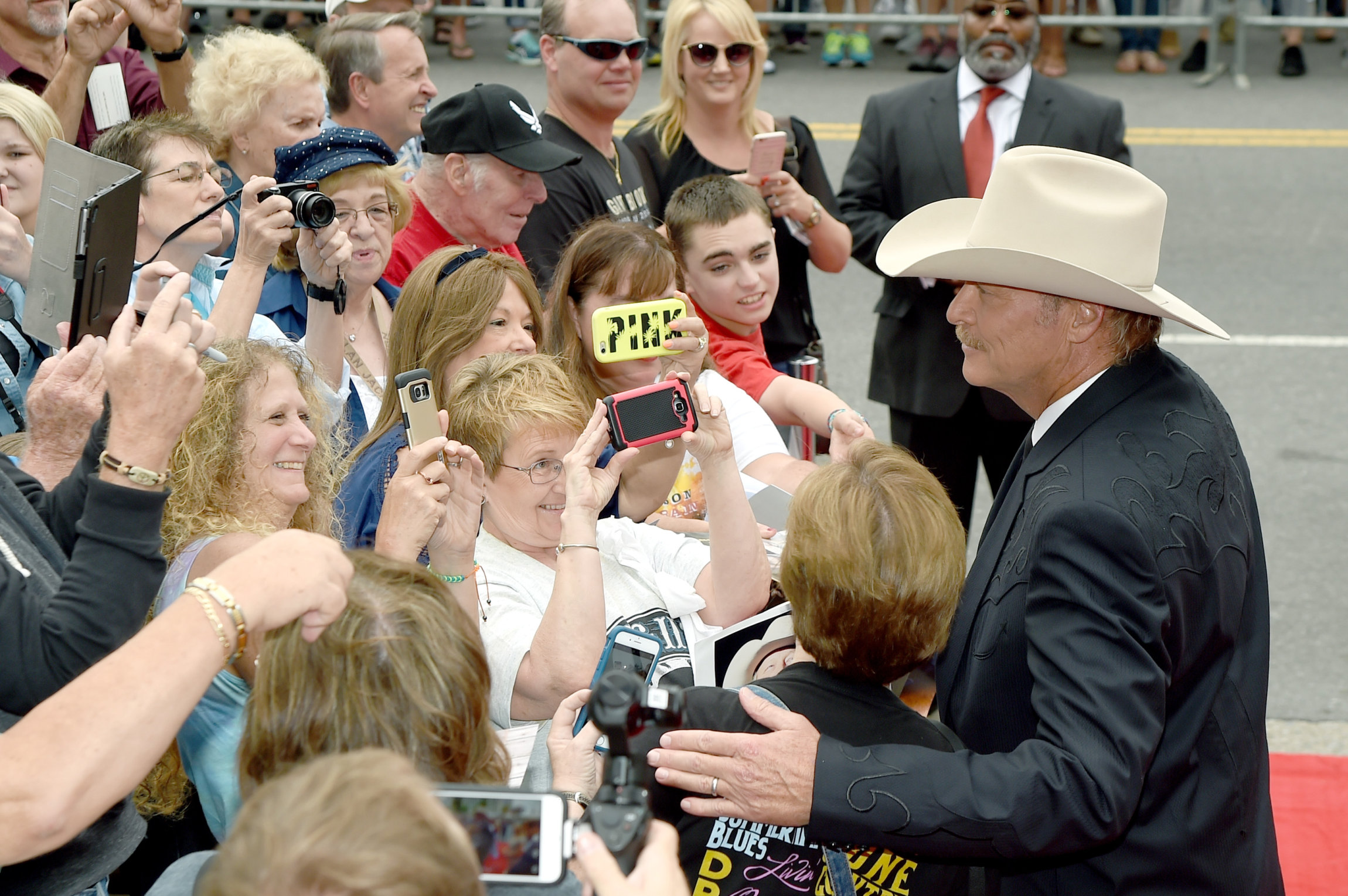 NASHVILLE, TN - OCTOBER 22: Singer-songwriter Alan Jackson takes photos with fans at the Country Music Hall of Fame and Museum Medallion Ceremony to celebrate 2017 hall of fame inductees Alan Jackson, Jerry Reed And Don Schlitz at Country Music Hall of Fame and Museum on October 22, 2017 in Nashville, Tennessee. (Photo by Rick Diamond/Getty Images for Country Music Hall Of Fame & Museum)