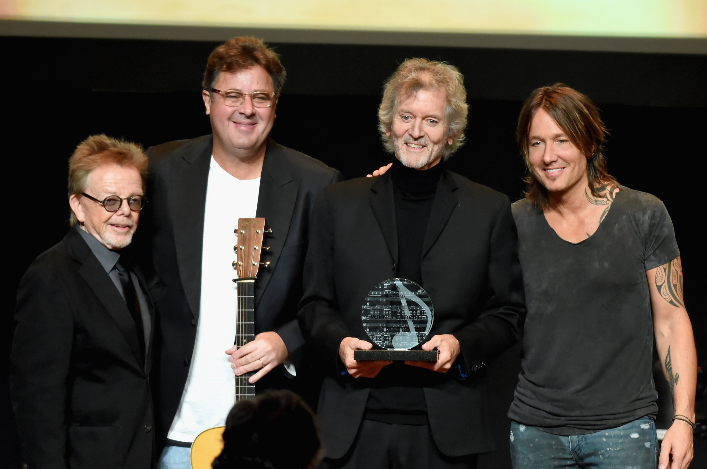 NASHVILLE, TN - NOVEMBER 06: Paul Williams, Vince Gill, Rodney Crowell, and Keith Urban pose for a photo onstage during the 55th annual ASCAP Country Music awards at the Ryman Auditorium on November 6, 2017 in Nashville, Tennessee. (Photo by Rick Diamond/Getty Images)