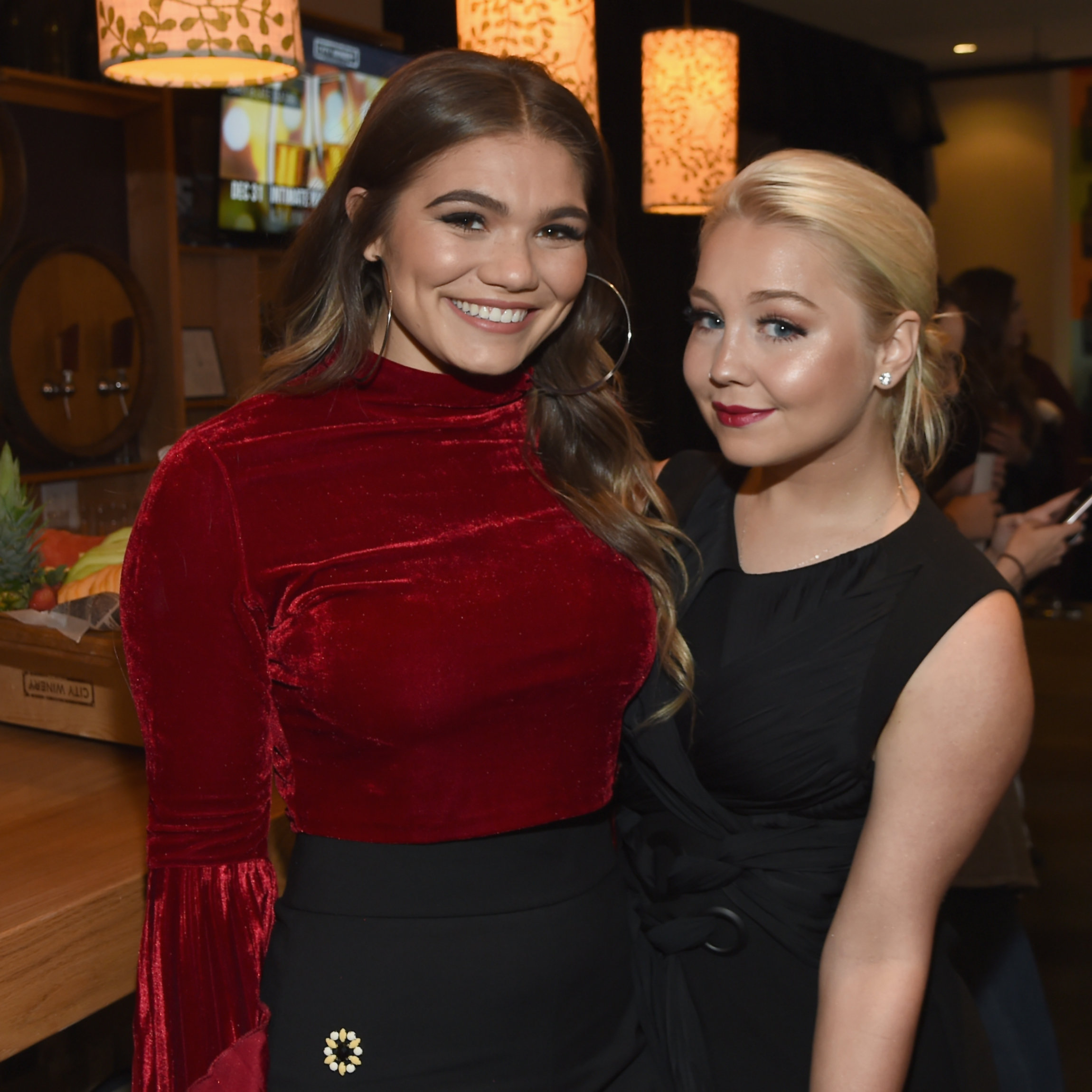 NASHVILLE, TN - NOVEMBER 07: Singer-songwriter Abby Anderson (L) and co-host RaeLynn (R) take photos before the 2017 CMT Next Women Of Country Celebration at City Winery Nashville on November 7, 2017 in Nashville, Tennessee. (Photo by Rick Diamond/Getty Images for CMT)