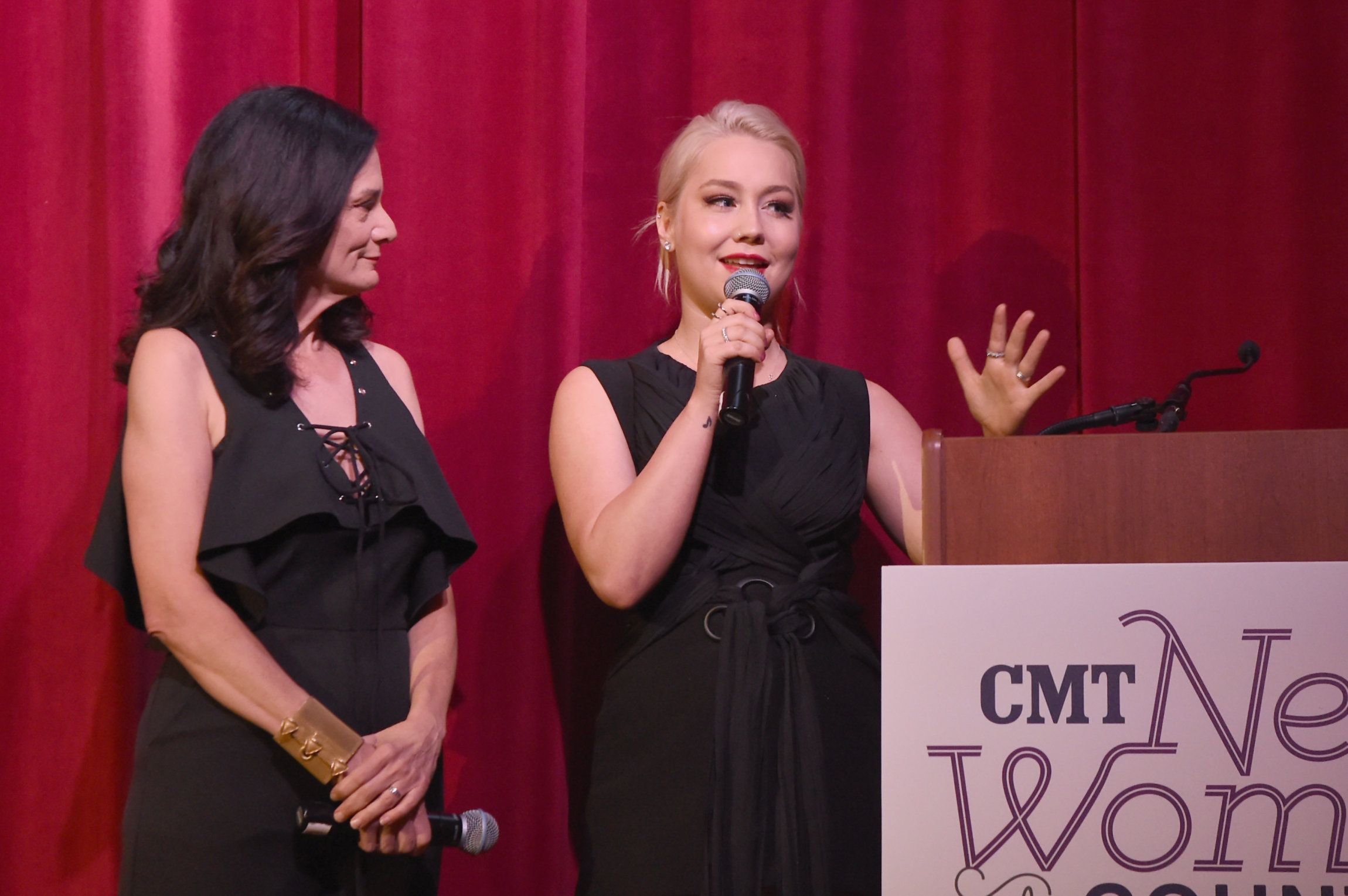 NASHVILLE, TN - NOVEMBER 07: Hosts Senior Vice President of Music Strategy for CMT Leslie Fram (L) and Raelynn (R) speak onstage during the 2017 CMT Next Women Of Country Celebration at City Winery Nashville on November 7, 2017 in Nashville, Tennessee. (Photo by Rick Diamond/Getty Images for CMT)