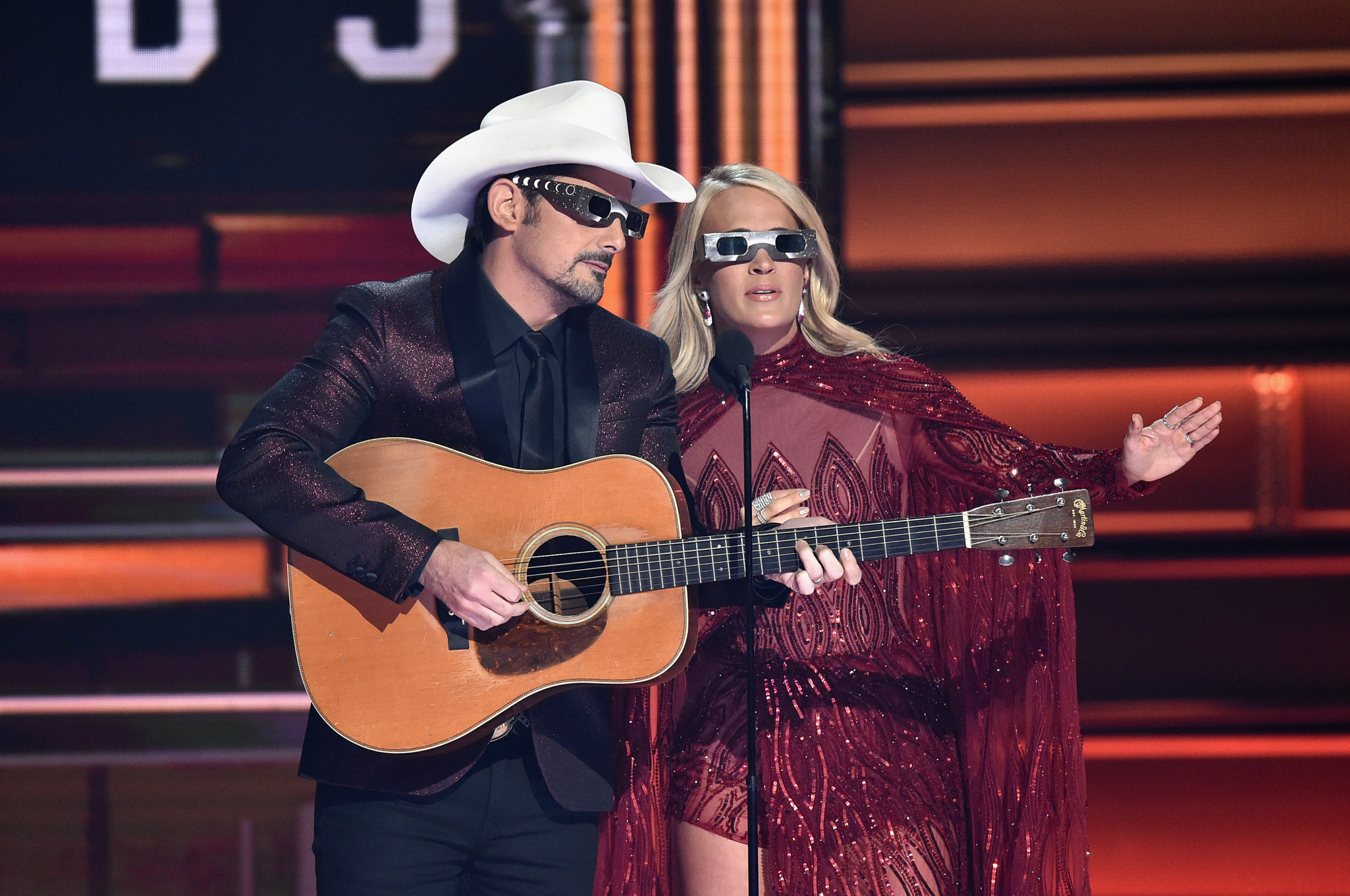 NASHVILLE, TN - NOVEMBER 08: Co-hosts Brad Paisley and Carrie Underwood speak onstage at the 51st annual CMA Awards at the Bridgestone Arena on November 8, 2017 in Nashville, Tennessee. (Photo by John Shearer/WireImage)