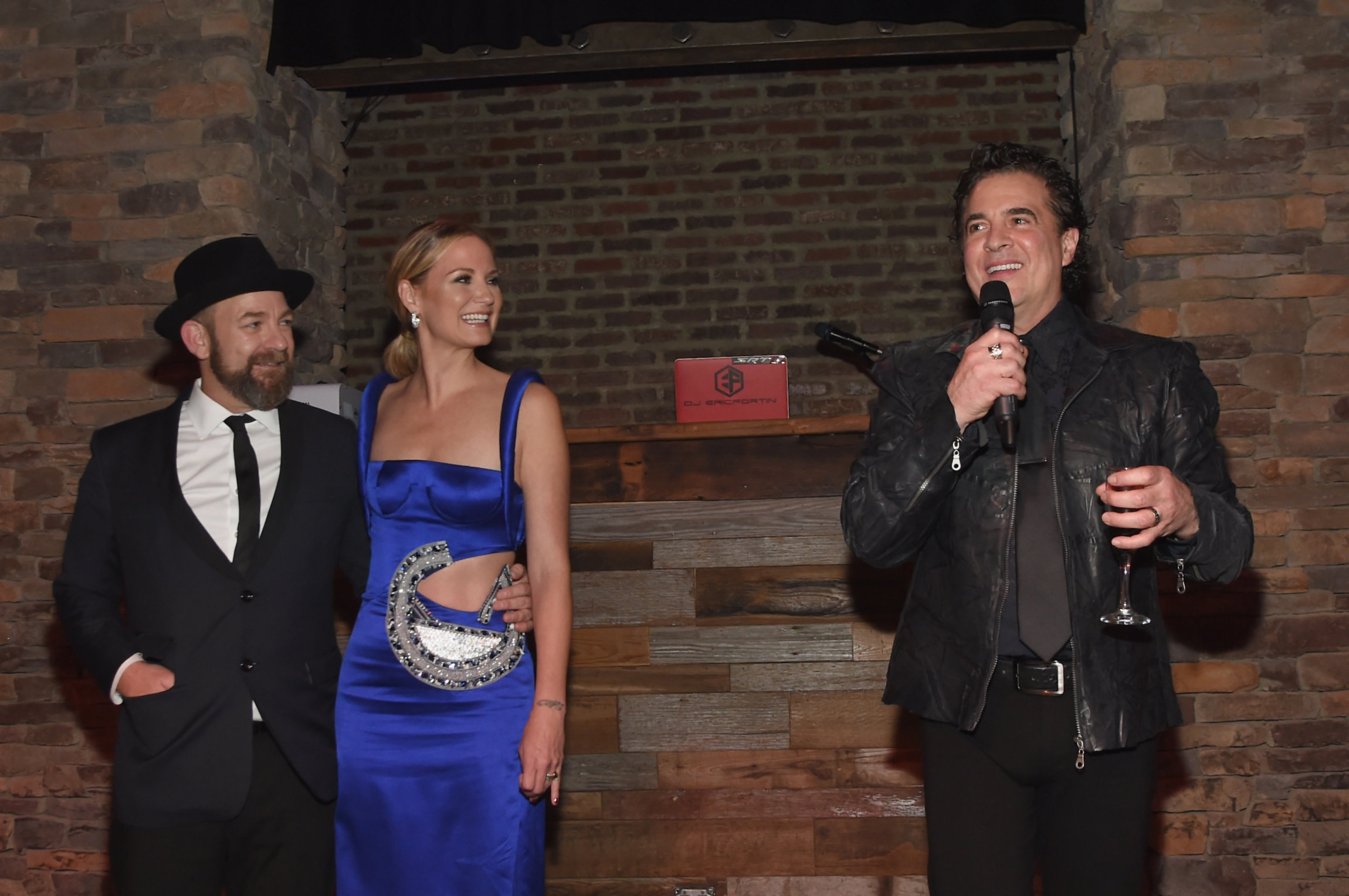 NASHVILLE, TN - NOVEMBER 09: (L-R) Kristian Bush and Jennifer Nettles of Sugarland and CEO of Big Machine Records Scott Borchetta speak onstage during the Big Machine Label Group's celebration of the 51st Annual CMA Awards at FGL House in Nashville on November 8, 2017 in Nashville, Tennessee. (Photo by Rick Diamond/Getty Images for BMLG )