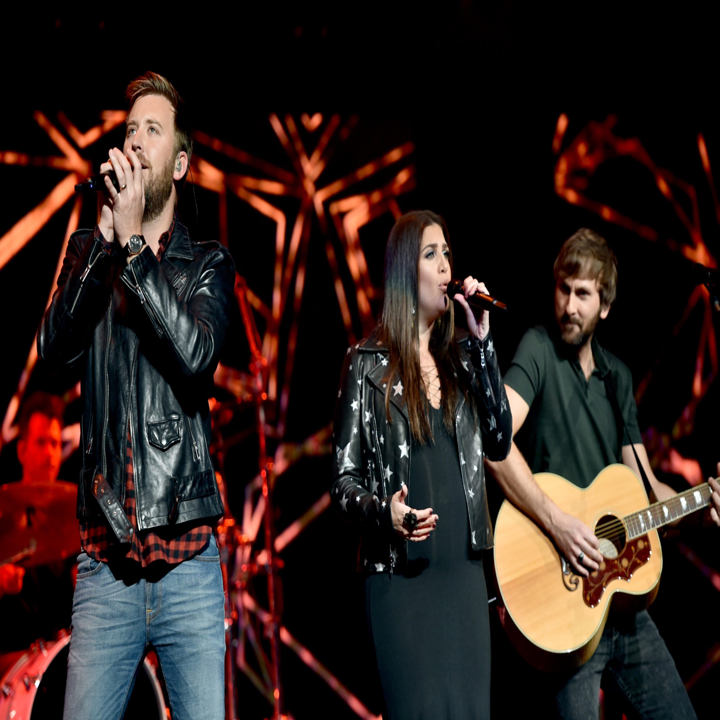 NASHVILLE, TN - NOVEMBER 12: In this handout photo provided by The Country Rising Fund of The Community Foundation of Middle Tennessee, (L-R) Singers Charles Kelley, Hillary Scott, and Dave Haywood of Lady Antebellum perform onstage for the Country Rising Benefit Concert at Bridgestone Arena on November 12, 2017 in Nashville, Tennessee. (Photo by John Shearer/Country Rising/Getty Images)