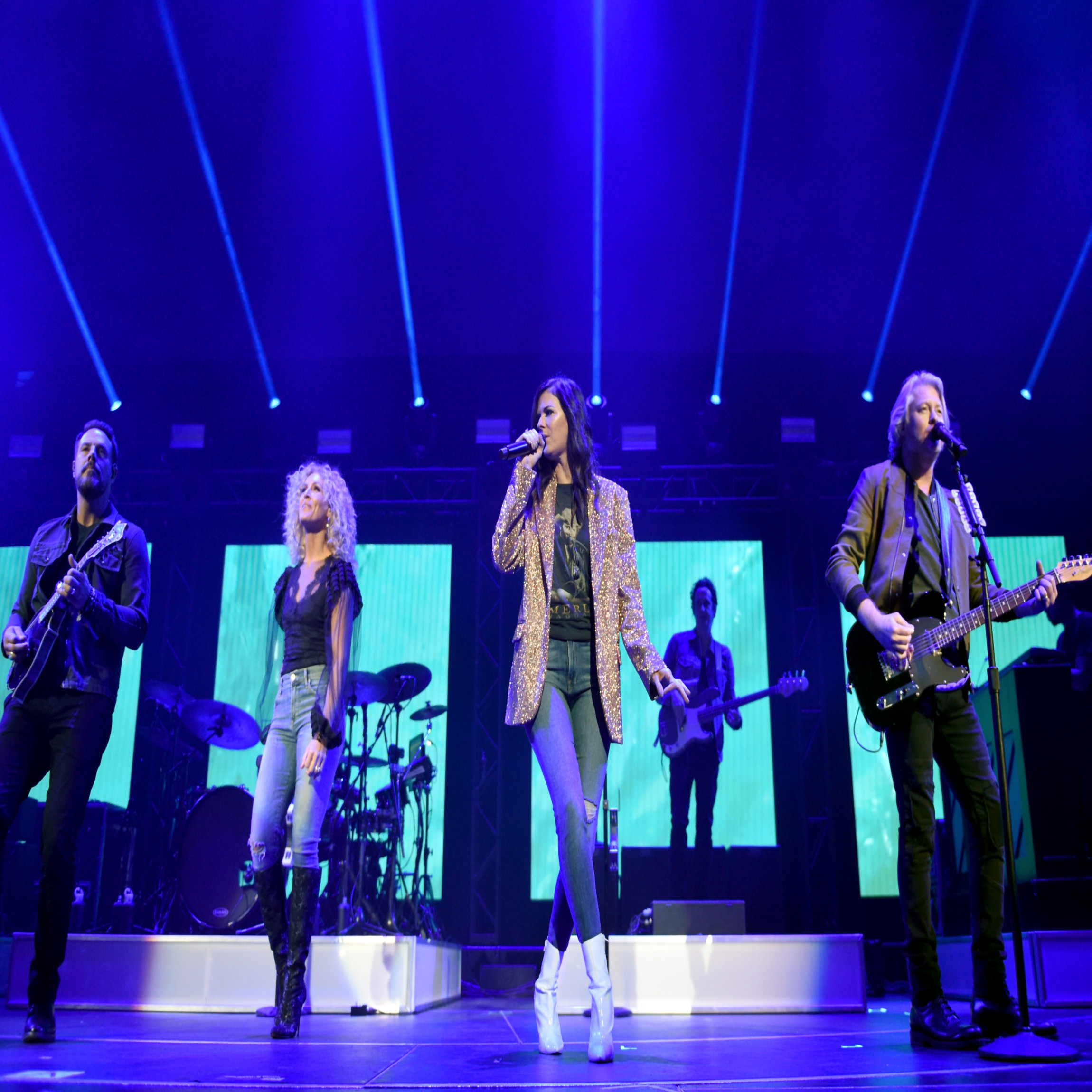 NASHVILLE, TN - NOVEMBER 12: In this handout photo provided by The Country Rising Fund of The Community Foundation of Middle Tennessee, (L-R) Jimi Westbrook, Kimberly Schlapman, Karen Fairchild and Philip Sweet of Little Big Town perform onstage for the Country Rising Benefit Concert at Bridgestone Arena on November 12, 2017 in Nashville, Tennessee. (Photo by John Shearer/Country Rising/Getty Images)