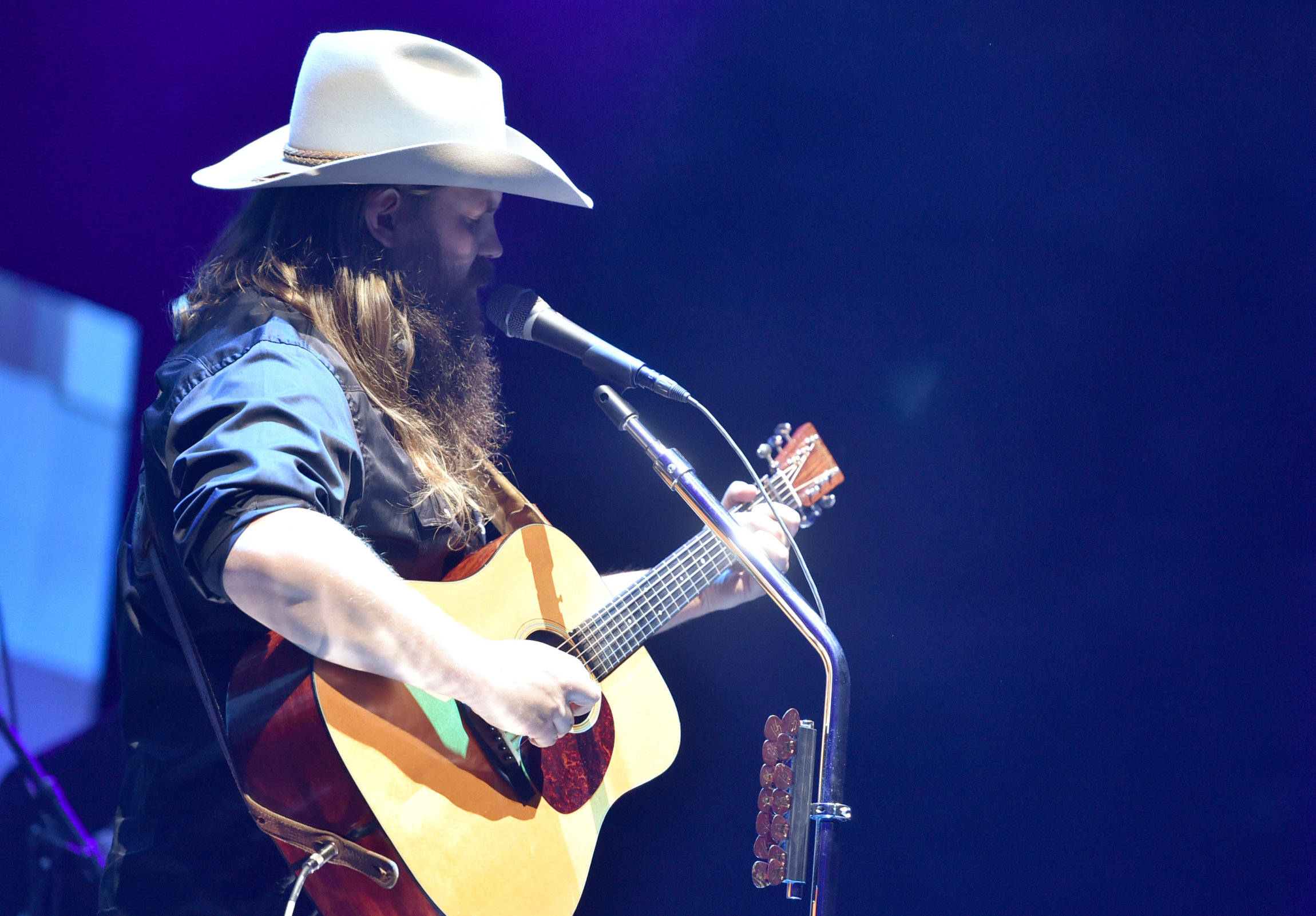 NASHVILLE, TN - NOVEMBER 12: In this handout photo provided by The Country Rising Fund of The Community Foundation of Middle Tennessee, singer-songwriter Chris Stapleton performs onstage for the Country Rising Benefit Concert at Bridgestone Arena on November 12, 2017 in Nashville, Tennessee. (Photo by John Shearer/Country Rising/Getty Images)