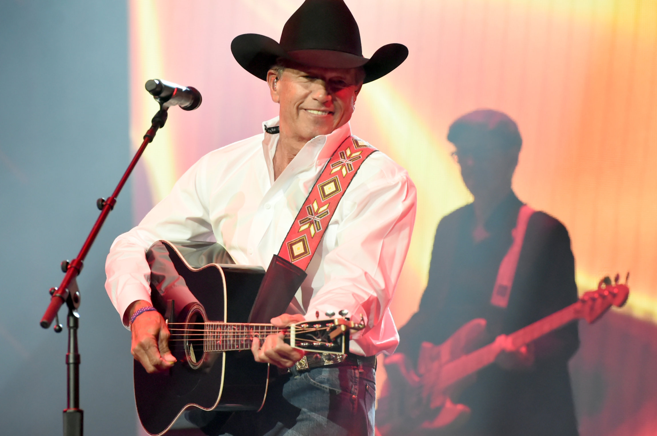 NASHVILLE, TN - NOVEMBER 12: In this handout photo provided by The Country Rising Fund of The Community Foundation of Middle Tennessee, singer-songwriter George Strait performs onstage for the Country Rising Benefit Concert at Bridgestone Arena on November 12, 2017 in Nashville, Tennessee. (Photo by Rick Diamond/Country Rising/Getty Images)