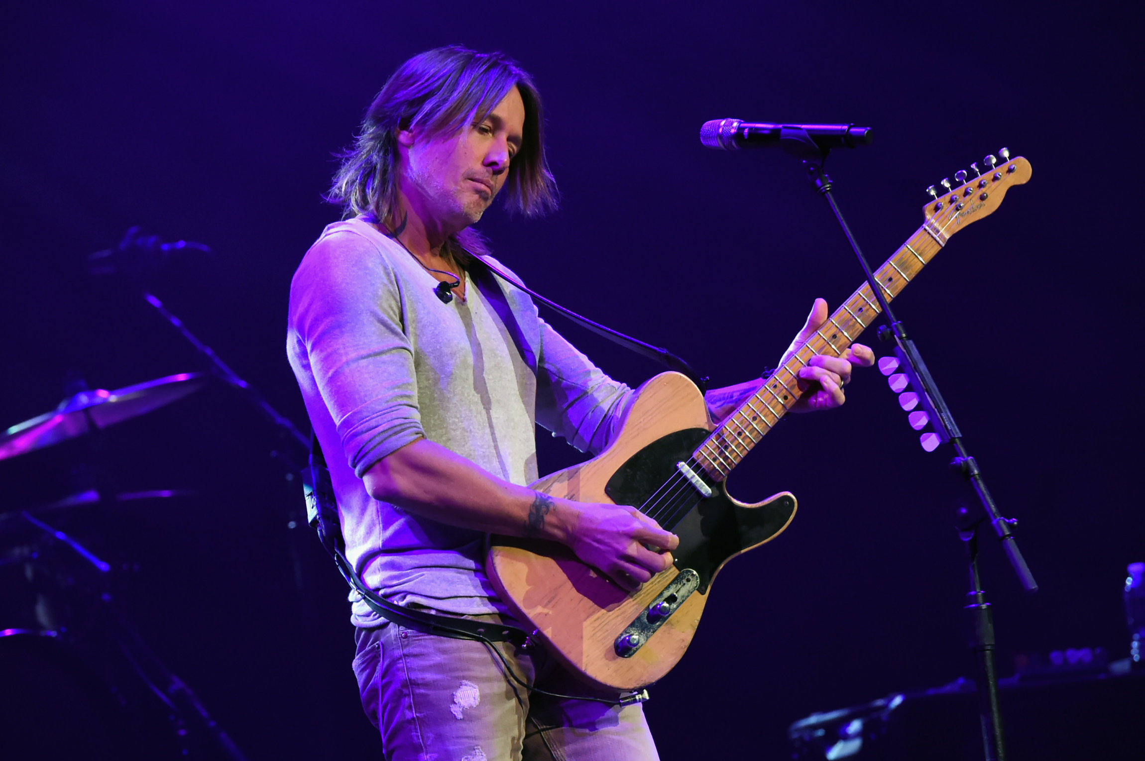 NASHVILLE, TN - NOVEMBER 12: In this handout photo provided by The Country Rising Fund of The Community Foundation of Middle Tennessee, musical artist Keith Urban performs onstage for the Country Rising Benefit Concert at Bridgestone Arena on November 12, 2017 in Nashville, Tennessee. (Photo by Rick Diamond/Country Rising/Getty Images)