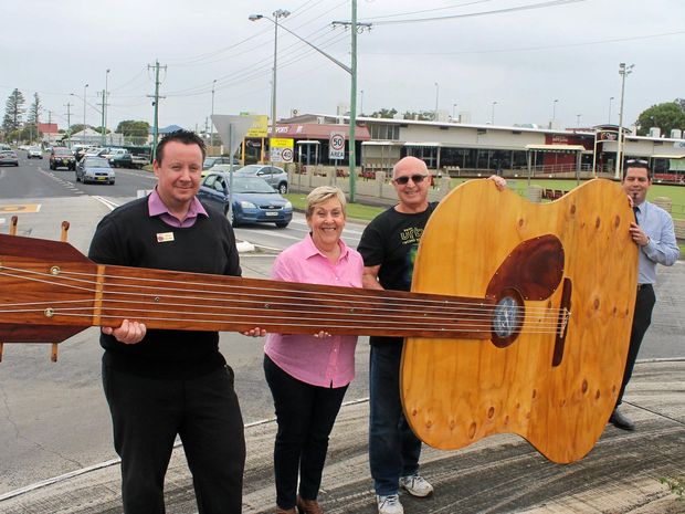 MUSIC IN THE STREET: The Ballina Country Music Festival is on this weekend. Pictured with the festival's giant guitar are Brad Benson, from the Cherry Street Sports Club, festival organisers Carol Stacey and Garry Lavercombe, and Cherry Street Sports Club general manager Tere Sheehan.