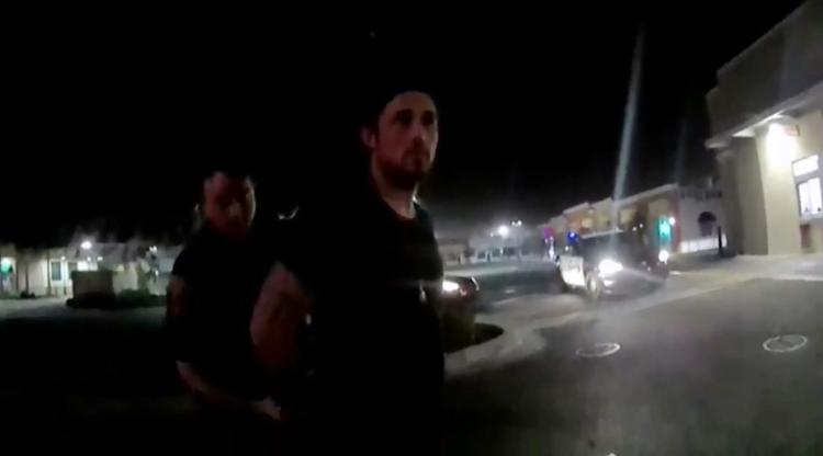 Body cam footage shows him being arrested in a McDonald’s parking lot.