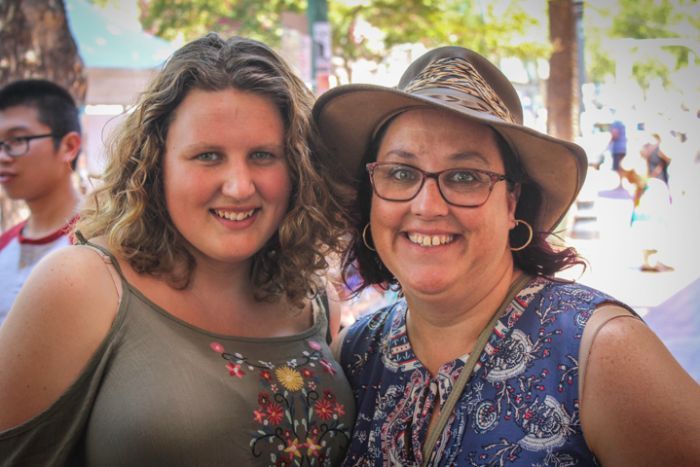 A mother and daughter stand together posing on the street in Tamworth