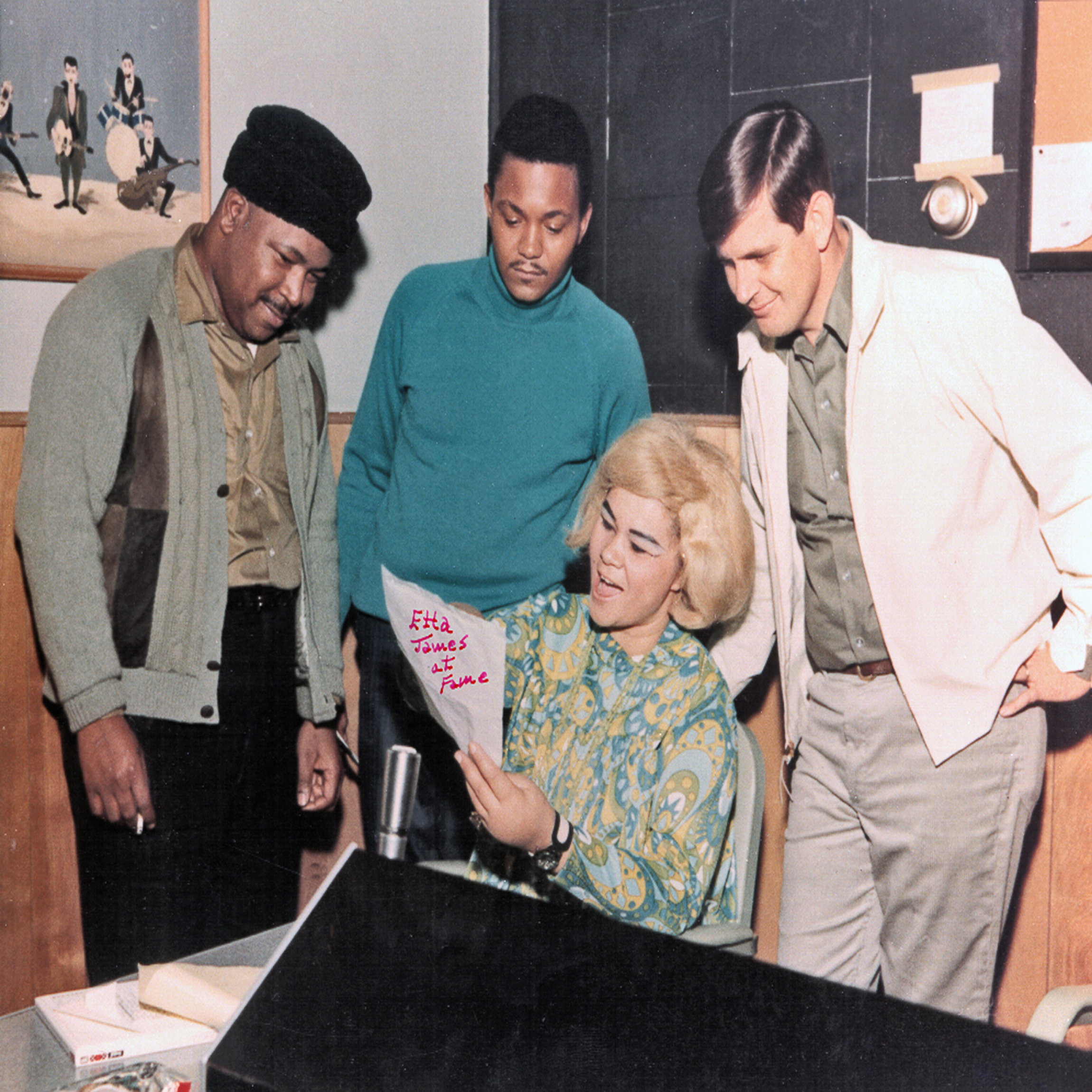 MUSCLE SHOALS AL - CIRCA 1967: R and B singer Etta James rehearses as owner of Fame Studios Rick Hall (right) and members of the house band look on during a recording session at Fame Studios circa 1967 in Muscle Shoals, Alabama. (Photo by House Of Fame LLC/Michael Ochs Archive/Getty Images)