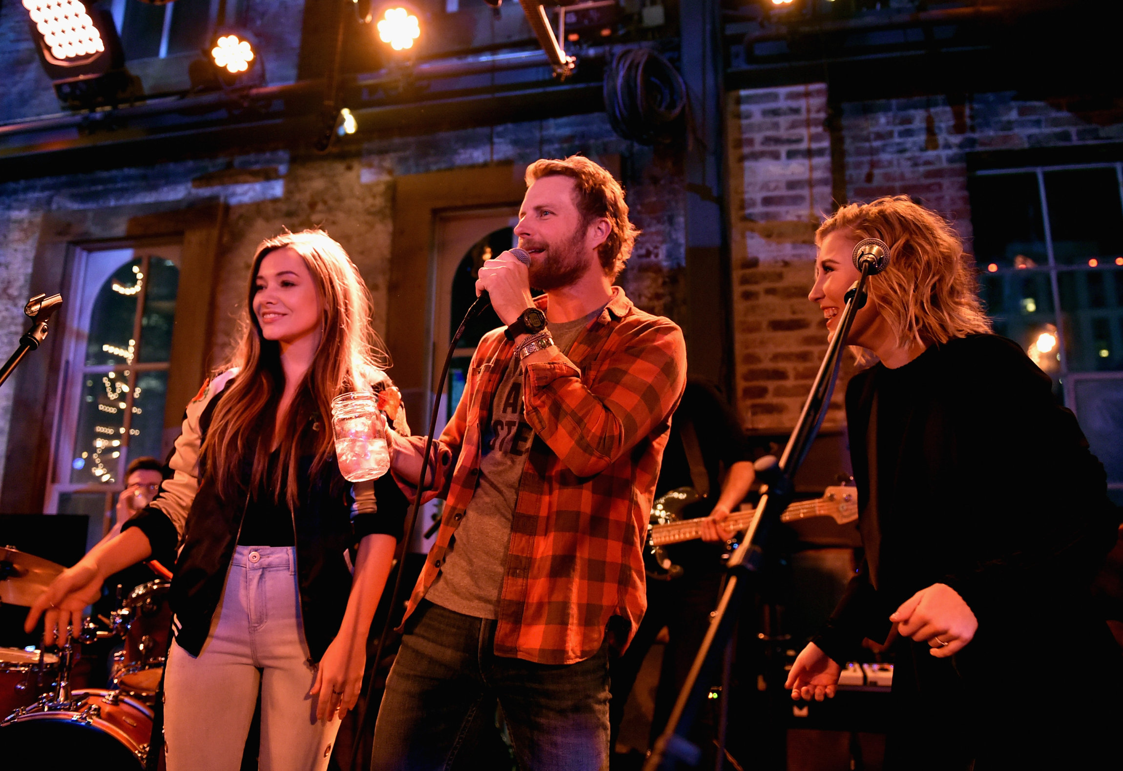 NASHVILLE, TN - JANUARY 14: Tae Dye (L) and Maddie Marlow (R) of Maddie & Tae and Dierks Bentley speak onstage during the Nashville Opening of Dierks Bentley's Whiskey Row on January 14, 2018 in Nashville, Tennesse (Photo by John Shearer/Getty Images for Dierks Bentley's Whiskey Row Nashville)